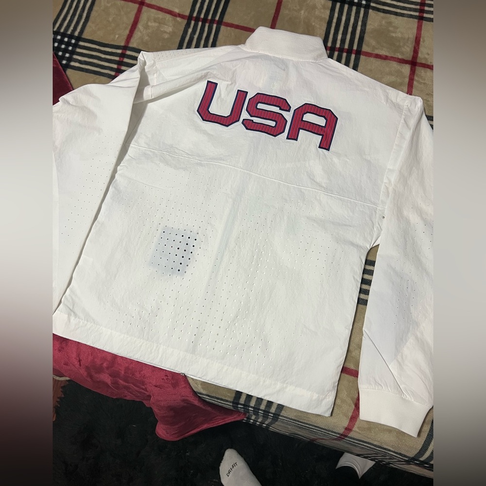 Never worn white nike 2020 olympic jacket. Size small still has the tags.